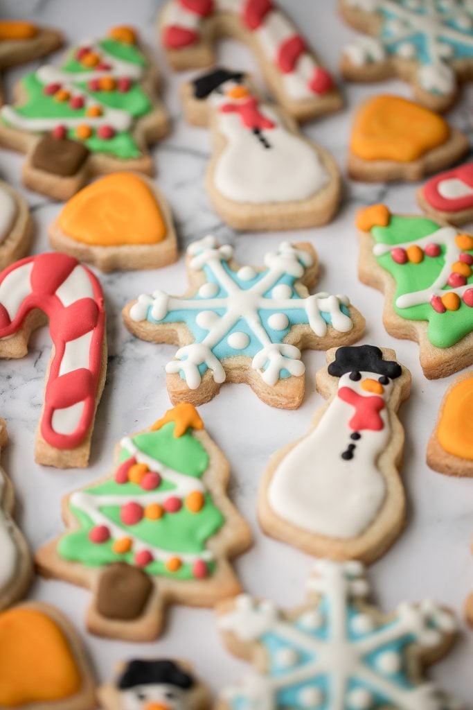 Christmas sugar cookies with royal icing are golden brown and crisp on the outside, but soft and tender inside. The best and festive gourmet holiday cookie. | aheadofthyme.com