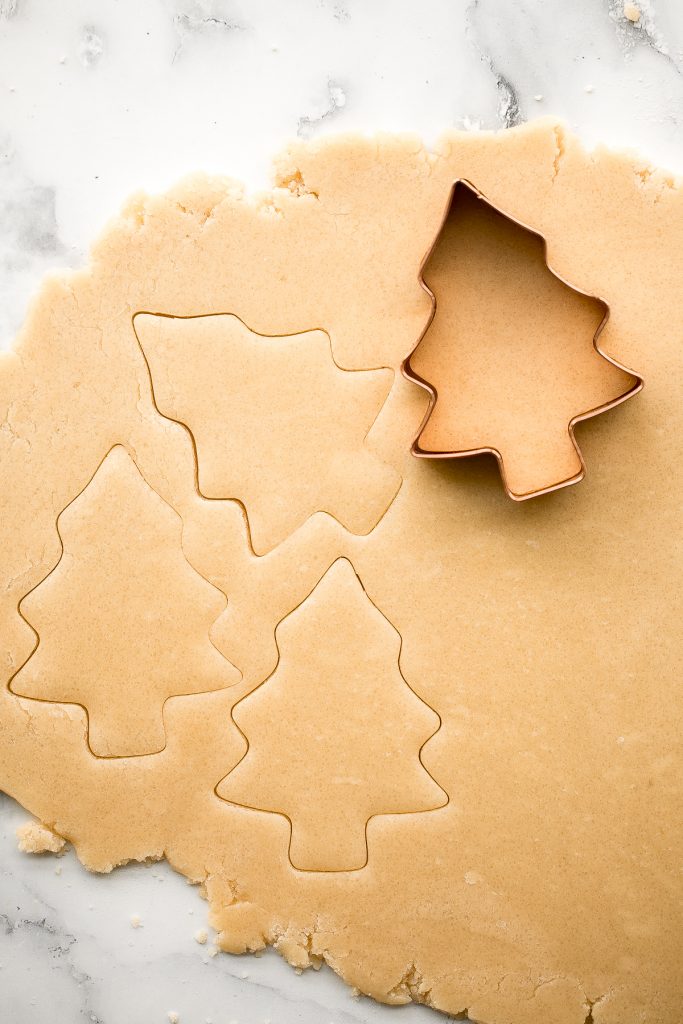 Christmas sugar cookies with royal icing are golden brown and crisp on the outside, but soft and tender inside. The best and festive gourmet holiday cookie. | aheadofthyme.com