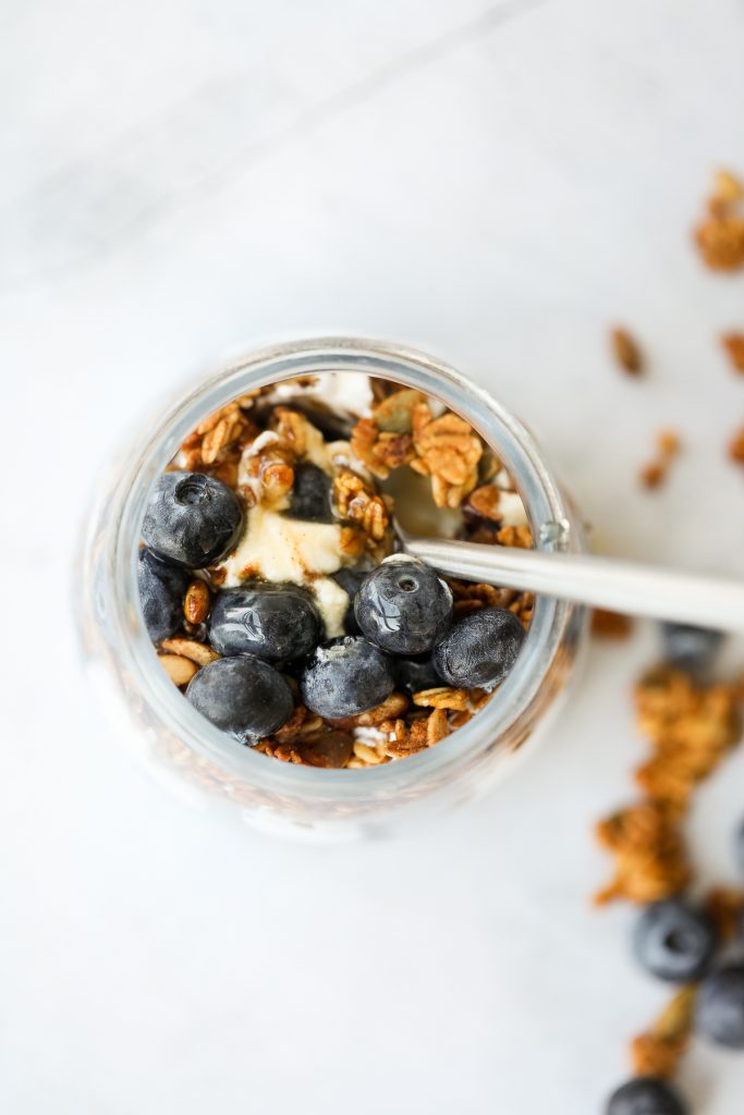 Layer fresh fruits, creamy Greek yogurt and crunchy granola to make this fruit and yogurt parfait for a delicious and healthy breakfast or a simple snack. | aheadofthyme.com