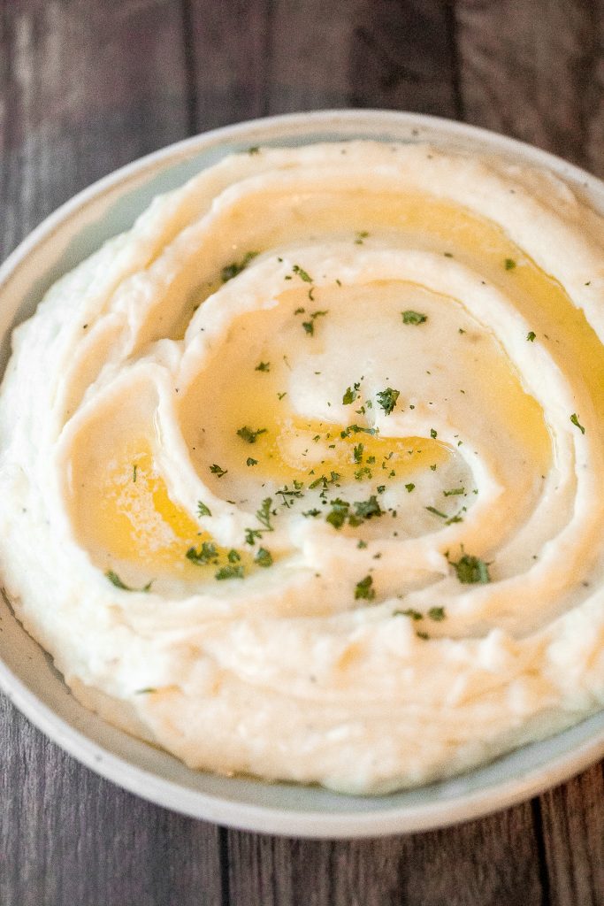 Healthy mashed potatoes are velvety, creamy, and delicious, with a fraction of the calories. Substitute with low-fat milk, Greek yogurt and chicken stock. | aheadofthyme.com