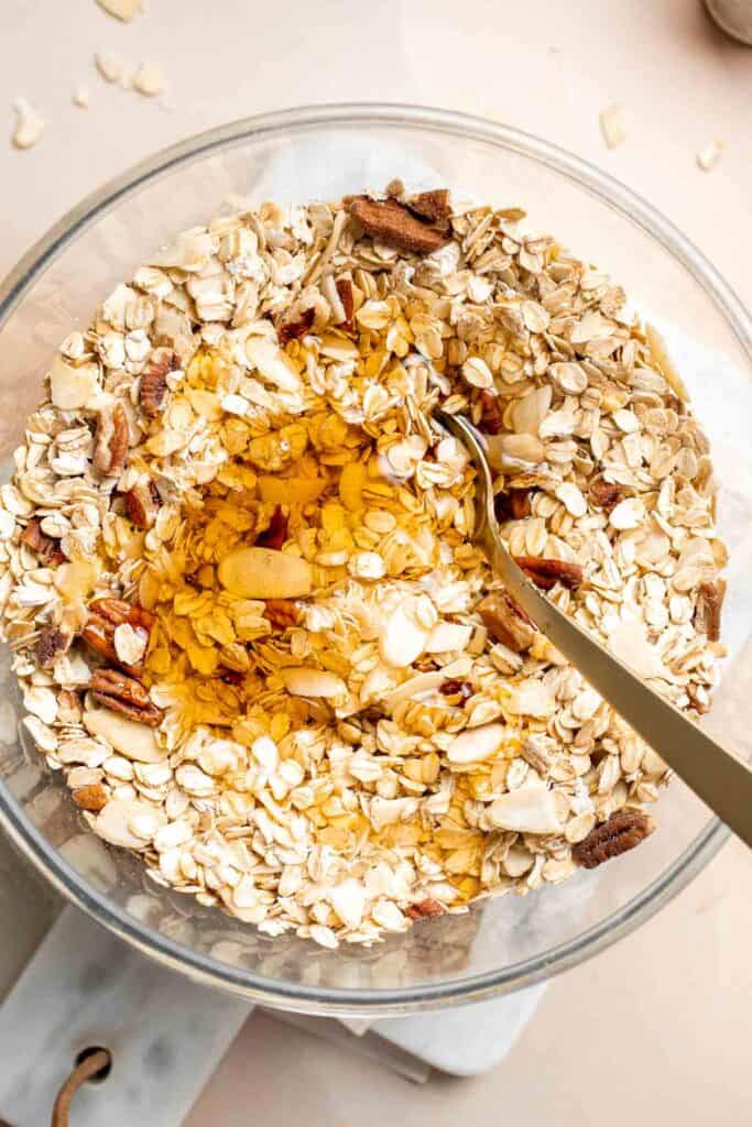 Homemade Granola is quick and easy to make at home using simple ingredients and 5 minutes of prep. This healthy snack is crunchy, delicious, and flavorful. | aheadofthyme.com