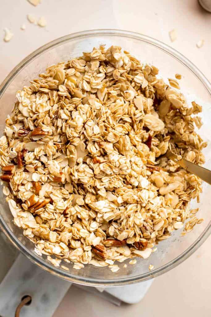 Homemade Granola is quick and easy to make at home using simple ingredients and 5 minutes of prep. This healthy snack is crunchy, delicious, and flavorful. | aheadofthyme.com