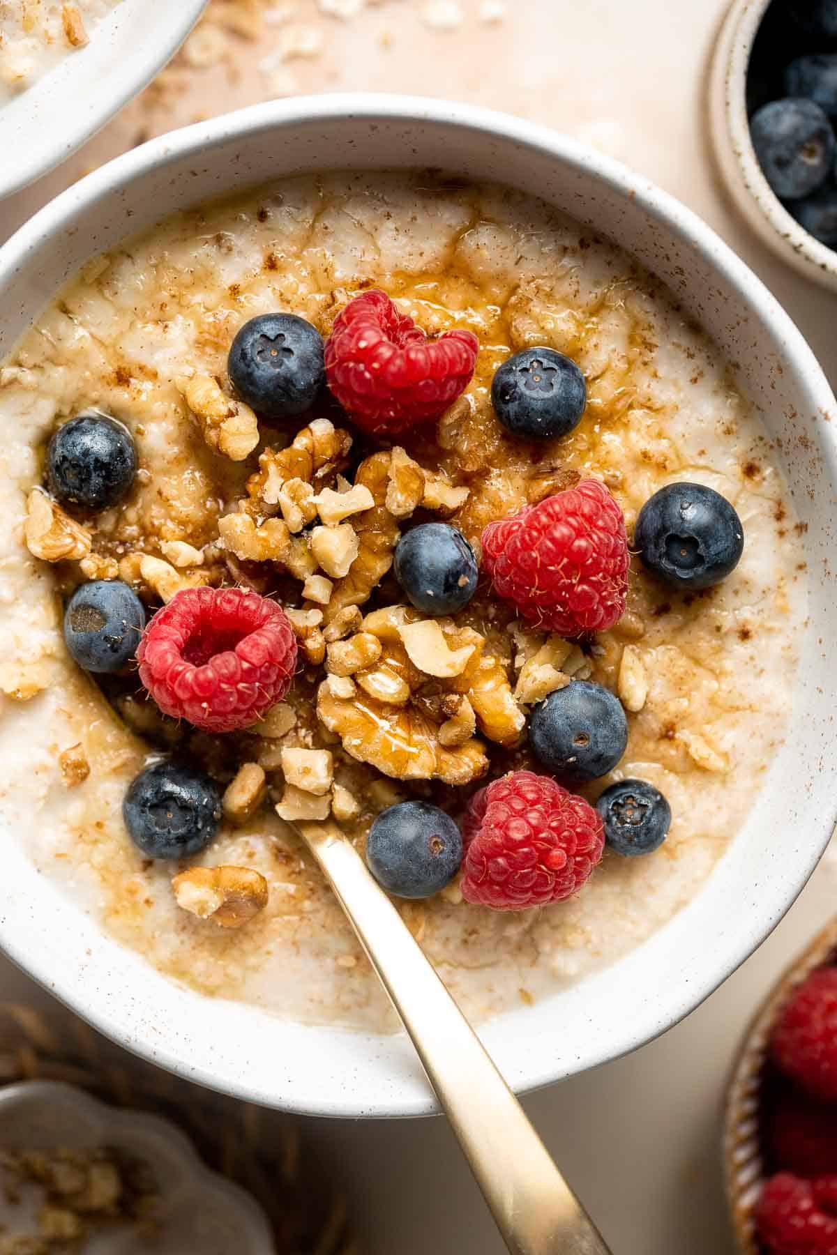 Oat Porridge is a healthy, delicious breakfast that's warm, comforting, cozy, and great for all ages. A quick easy recipe to warm you up on cold mornings. | aheadofthyme.com