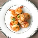 Quick and easy, pan-fried garlic prawns with soy sauce, garlic, and green onions is a simple but flavourful Chinese stir-fry made in under 15 minutes. | aheadofthyme.com