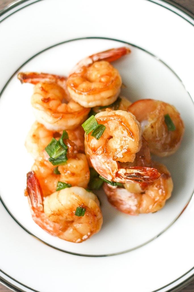 Quick and easy, pan-fried garlic prawns with soy sauce, garlic, and green onions is a simple but flavourful Chinese stir-fry made in under 15 minutes. | aheadofthyme.com