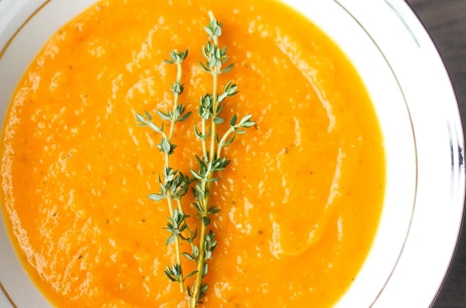 Roasted Butternut Squash Soup: This delicious roasted butternut squash soup sums up the taste of the holidays in one spoon. Rosemary, sage and thyme, need I say more? | aheadofthyme.com