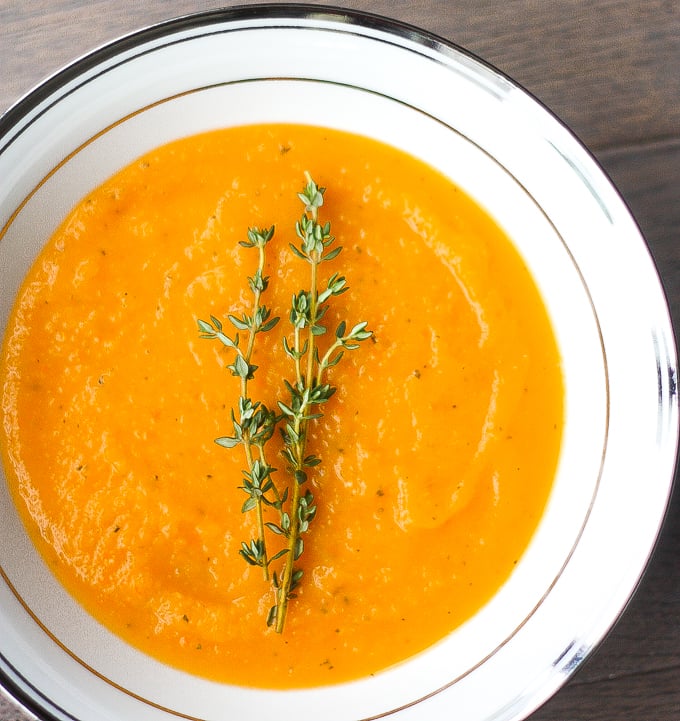 This delicious and easy roasted butternut squash soup brings all the taste of the holidays in one spoon. Rosemary, sage and thyme, need I say more? | aheadofthyme.com