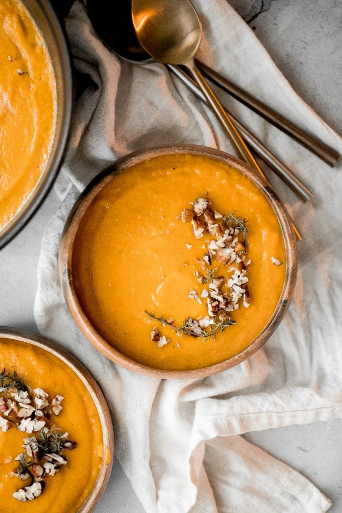 This easy, delicious, vegan roasted butternut squash soup sums up the taste of the holidays in one spoon. Rosemary, sage and thyme, need I say more? | aheadofthyme.com