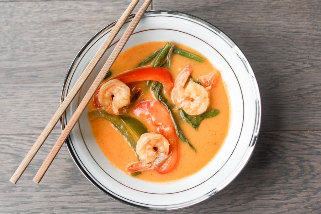 Better than takeout, Thai coconut red curry with prawns is easy, quick, and full of so much flavour! Cook this perfect weeknight dinner in just 15 minutes! | aheadofthyme.com