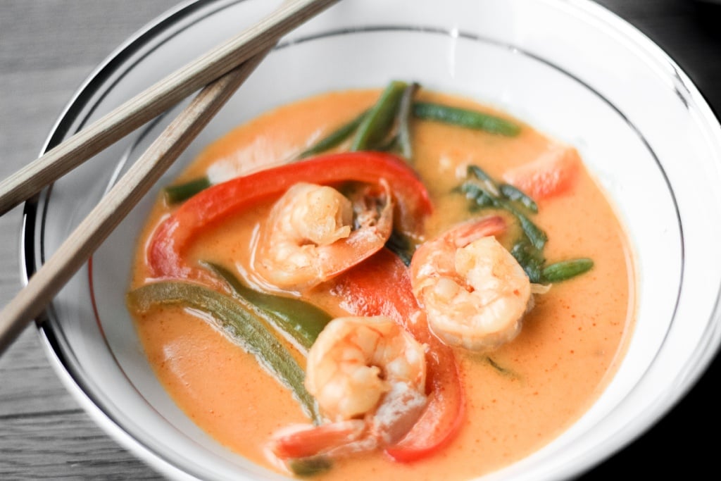 Better than takeout, Thai coconut red curry with prawns is easy, quick, and full of so much flavour! Cook this perfect weeknight dinner in just 15 minutes! | aheadofthyme.com