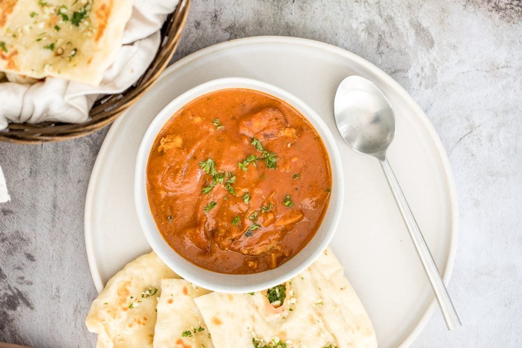 Better than takeout, make easy Indian butter chicken in just 30 minutes, with a creamy tomato-based sauce, charred chicken, and incredible spice + flavour. | aheadofthyme.com