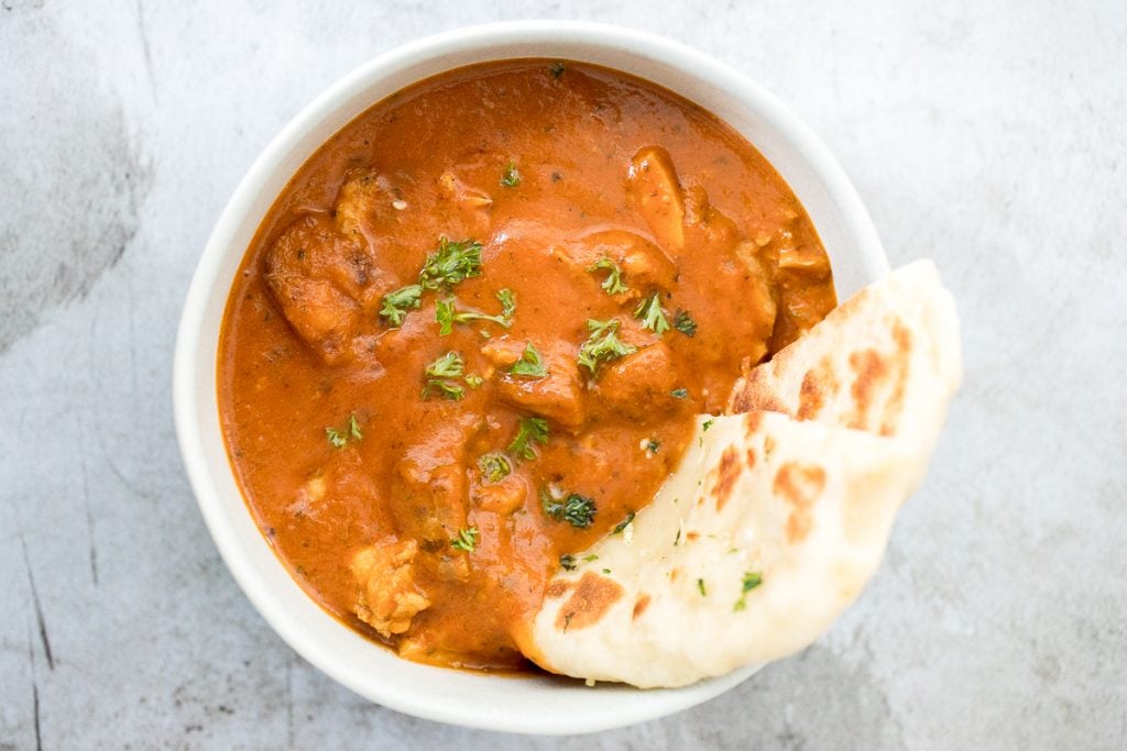 Better than takeout, make easy Indian butter chicken in just 30 minutes, with a creamy tomato-based sauce, charred chicken, and incredible spice + flavour. | aheadofthyme.com