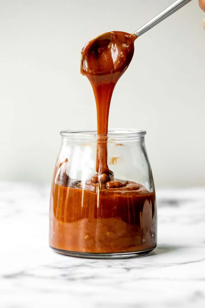 Homemade salted caramel sauce is sweet, salty, and buttery. It's so simple and easy to make at home in just 10 minutes with 4 basic ingredients. | aheadofthyme.com