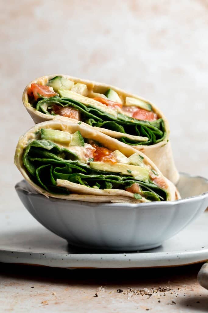 Vegan hummus wrap is a quick easy lunch made in minutes with a handful of fresh ingredients. This delicious veggie wrap is healthy, fresh, nutritious. | aheadofthyme.com