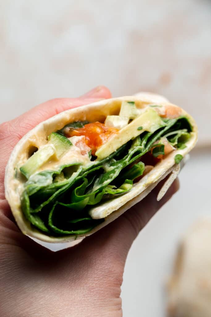 Vegan hummus wrap is a quick easy lunch made in minutes with a handful of fresh ingredients. This delicious veggie wrap is healthy, fresh, nutritious. | aheadofthyme.com