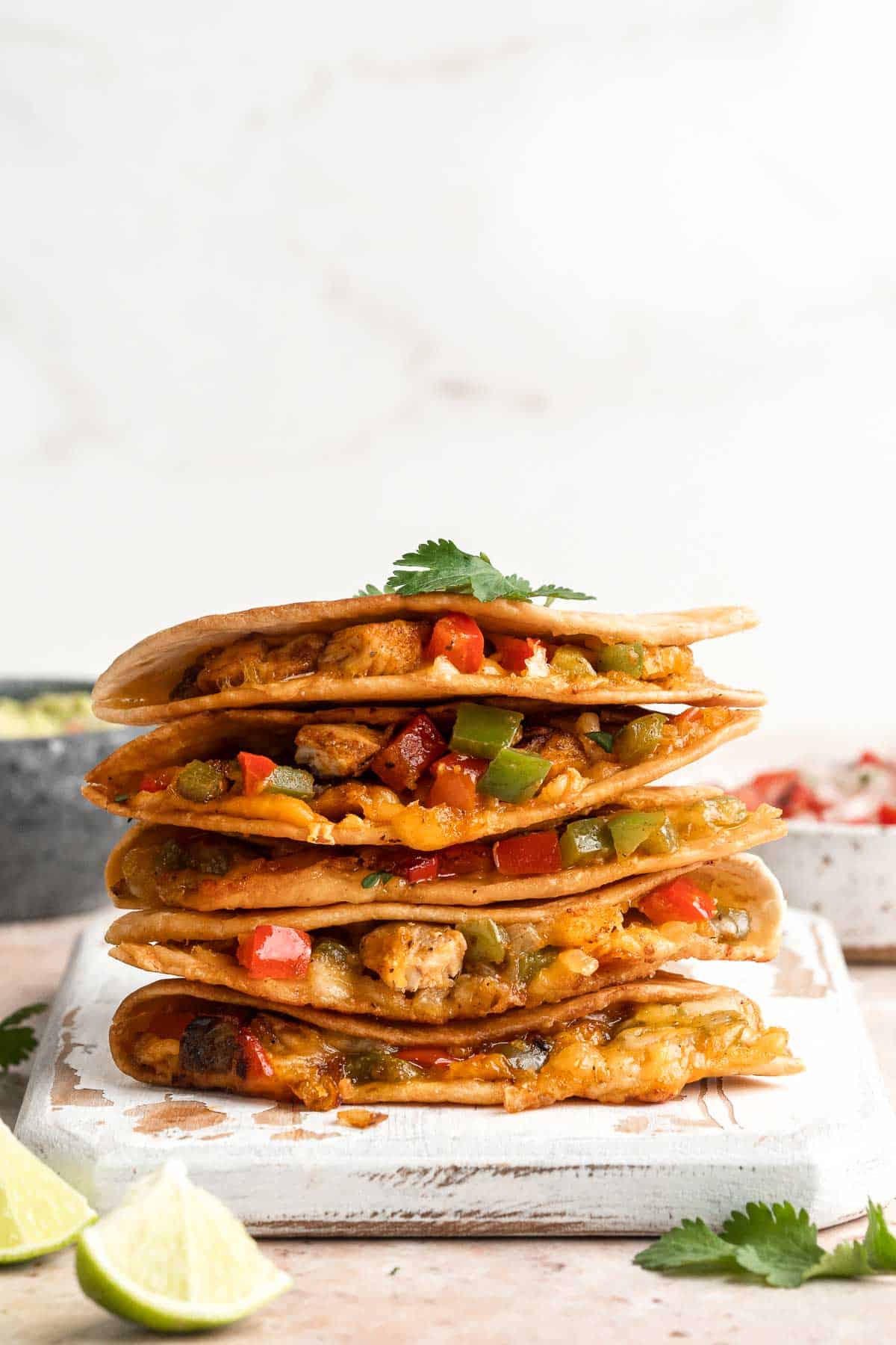 Baked Chicken Quesadillas are cheesy, crispy, flavorful, and delicious. This family-friendly recipe is quick and easy to make in just 30 minutes! | aheadofthyme.com