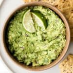 Delicious and easy guacamole is simple to make with just a few fresh ingredients in 5 minutes. This popular authentic Mexican dip is a total crowd-pleaser. | aheadofthyme.com
