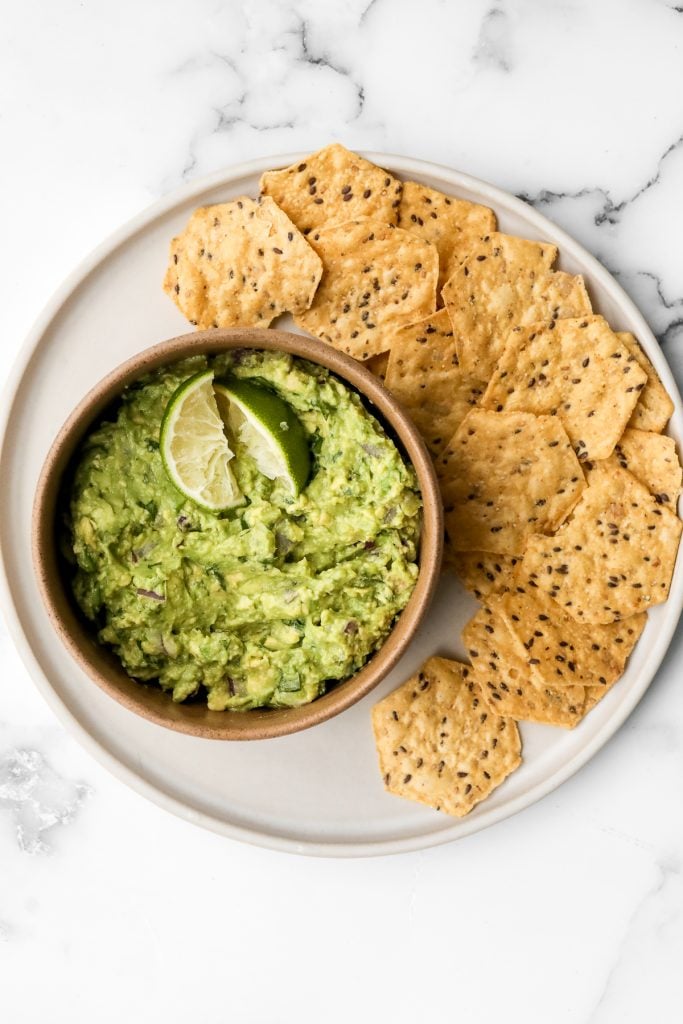 Delicious and easy guacamole is simple to make with just a few fresh ingredients in 5 minutes. This popular authentic Mexican dip is a total crowd-pleaser. | aheadofthyme.com