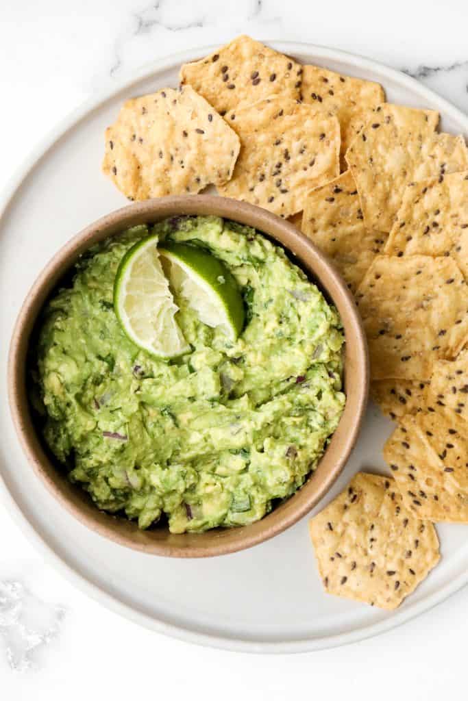 Delicious and easy guacamole is simple to make with just a few fresh ingredients in 5 minutes. This popular authentic Mexican dip is a total crowd-pleaser. | aheadofthyme.com