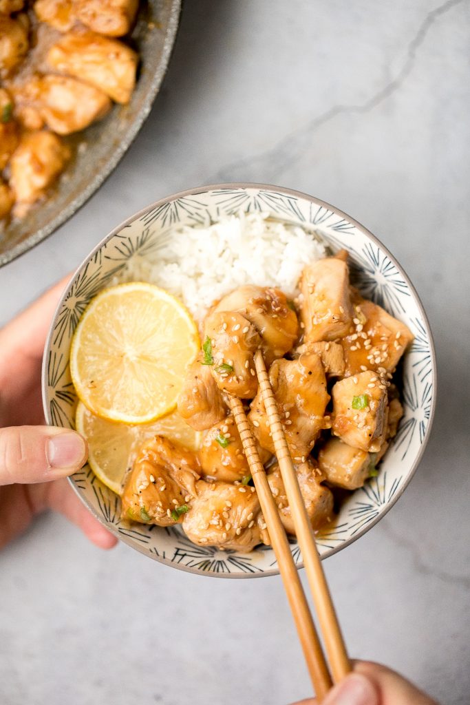 Better than takeout, healthy lemon chicken is a delicious, sticky chicken stir fry coated in a flavourful, sweet and tangy sauce. The best weeknight dinner. | aheadofthyme.com