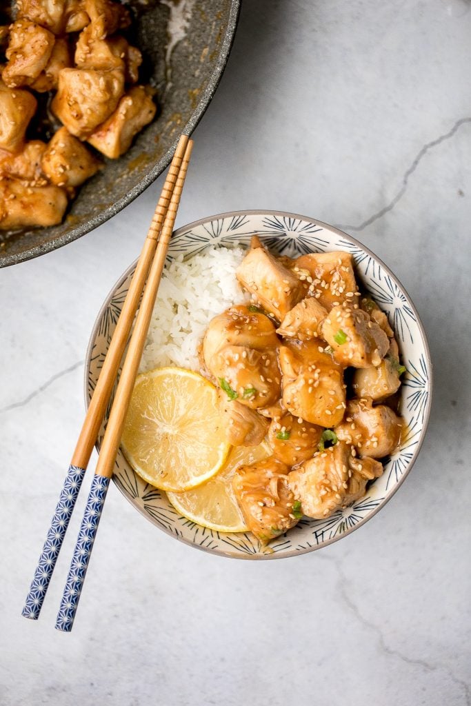 Better than takeout, healthy lemon chicken is a delicious, sticky chicken stir fry coated in a flavourful, sweet and tangy sauce. The best weeknight dinner. | aheadofthyme.com