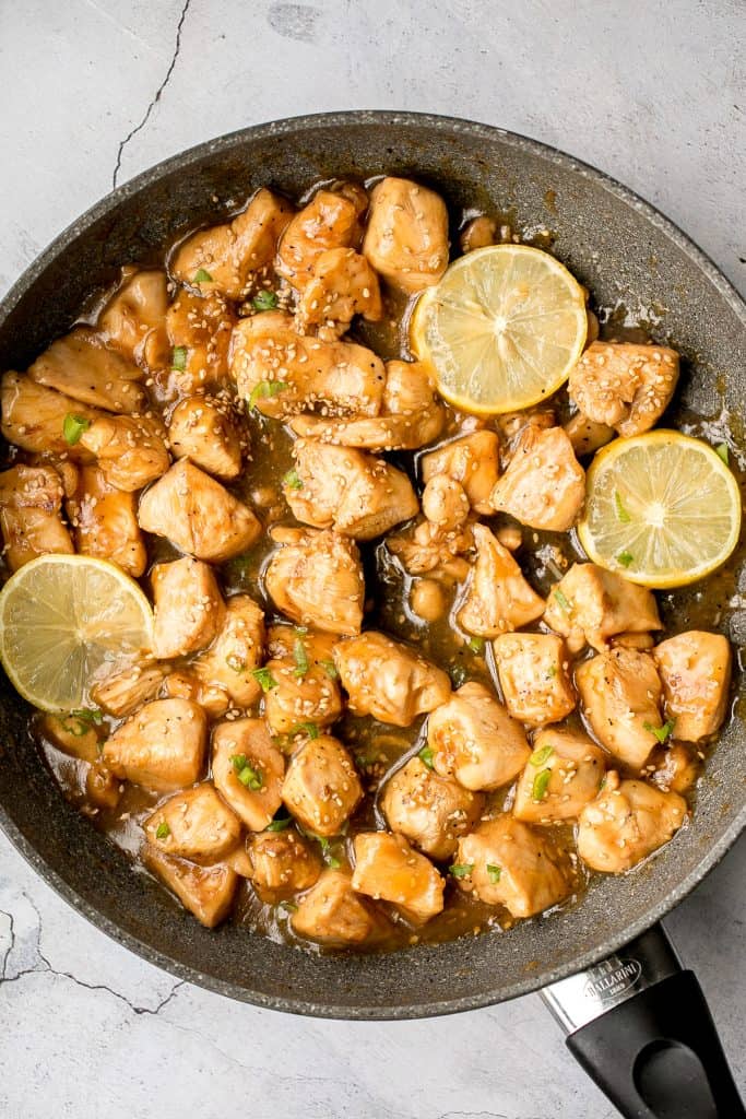 Better than takeout, healthy lemon chicken is a delicious, sticky chicken stir fry coated in a flavourful, sweet and tangy sauce. The best weeknight dinner. | aheadofthyme.com