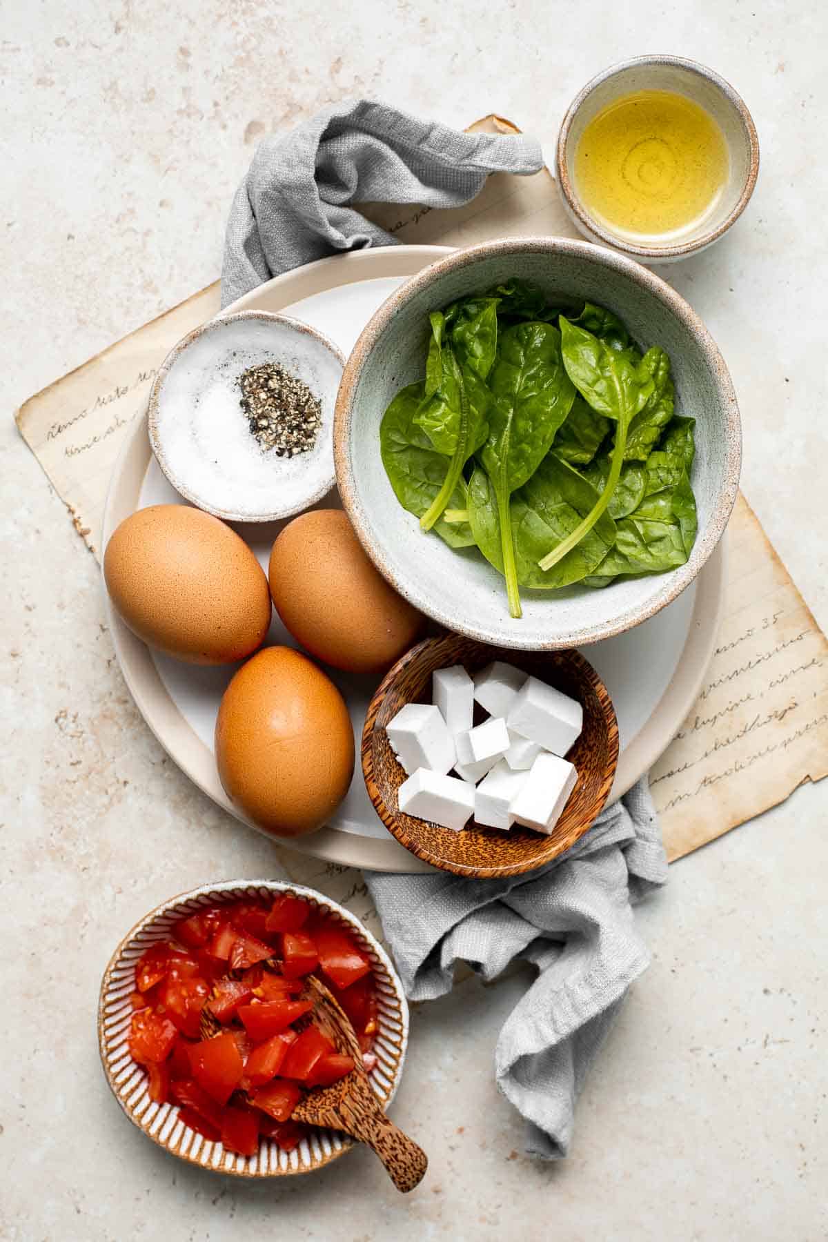 Mediterranean Scrambled Eggs with spinach, tomato, and feta is loaded with flavor and a quick and easy breakfast to make in under 10 minutes (with prep!). | aheadofthyme.com