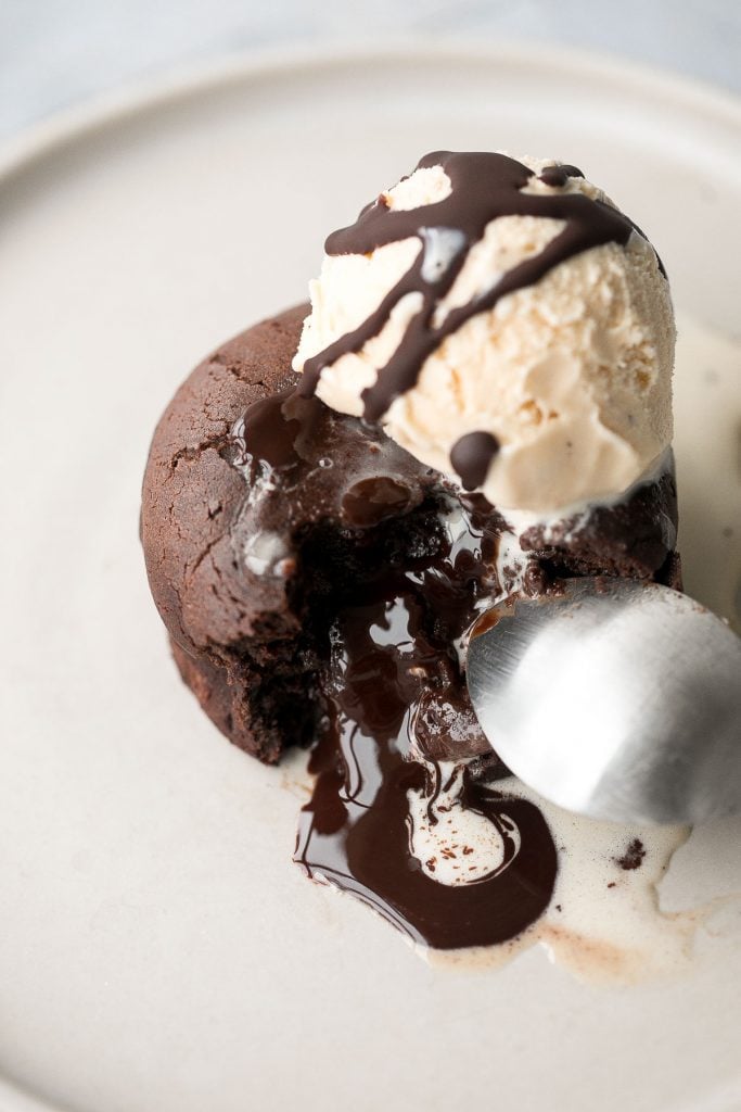 Molten chocolate lava cakes are rich and fudgy with a classic gooey chocolate center that flows out like lava. So simple and easy to make. | aheadofthyme.com