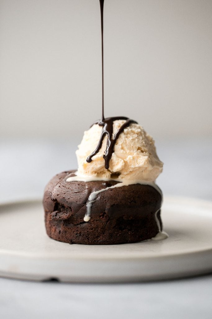 Molten chocolate lava cakes are rich and fudgy with a classic gooey chocolate center that flows out like lava. So simple and easy to make. | aheadofthyme.com