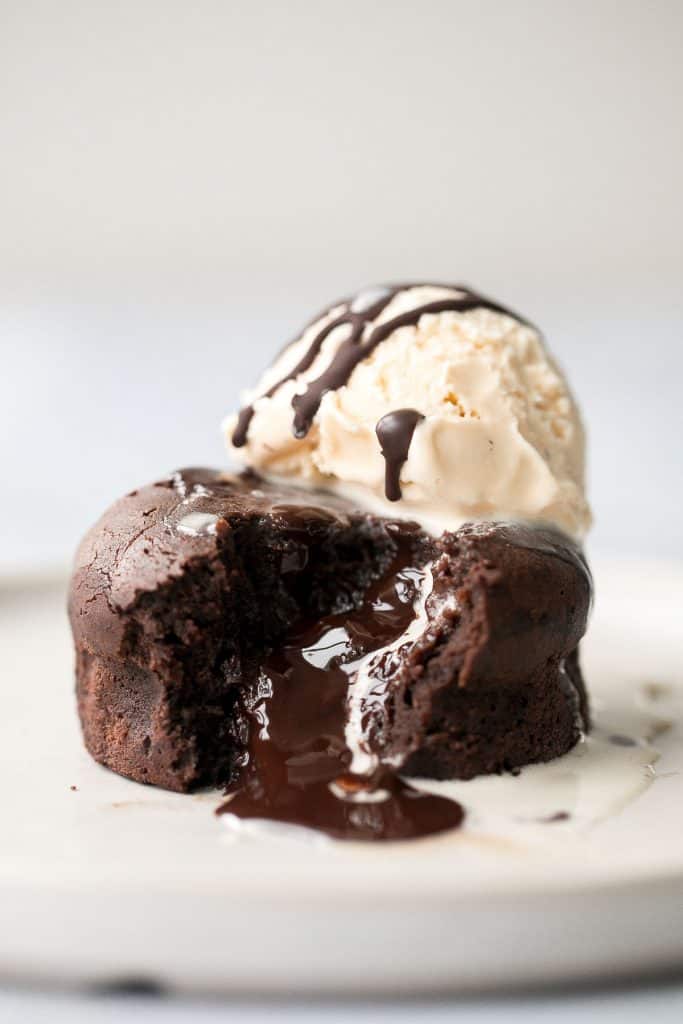 Molten chocolate lava cakes are rich and fudgy with a classic gooey chocolate center that flows out like lava. So simple and easy to make. | aheadofthyme.com