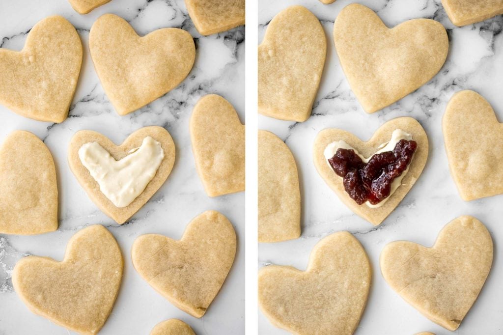 Cute raspberry and white chocolate heart-shaped shortbread cookies literally melt in your mouth. They are the perfect Valentine's Day treat. | aheadofthyme.com