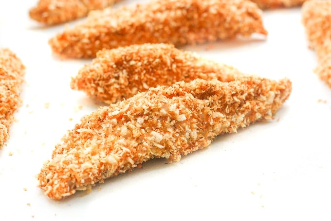 Baked Crispy Chicken Strips: Juicy long strips of chicken shaped perfectly for dipping and coated with a flawless crispy and crunchy exterior, baked crispy chicken strips are a pleaser | aheadofthyme.com