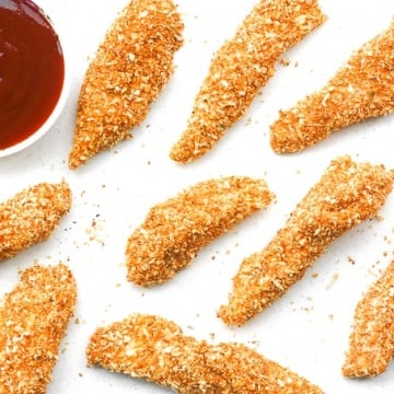 Baked Crispy Chicken Strips: Juicy long strips of chicken shaped perfectly for dipping and coated with a flawless crispy and crunchy exterior, baked crispy chicken strips are a pleaser | aheadofthyme.com