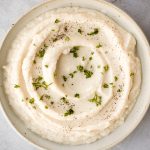 Craving a big serving of mashed potatoes but with a quarter of the calories? Now you can with creamy garlic mashed cauliflower. Ready in just 20 minutes. | aheadofthyme.com