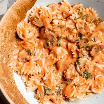 Farfalle pasta with mushroom rose sauce is creamy yet light, delicious and flavorful, and quick and easy to make in 20 minutes. Best comfort food dinner! | aheadofthyme.com