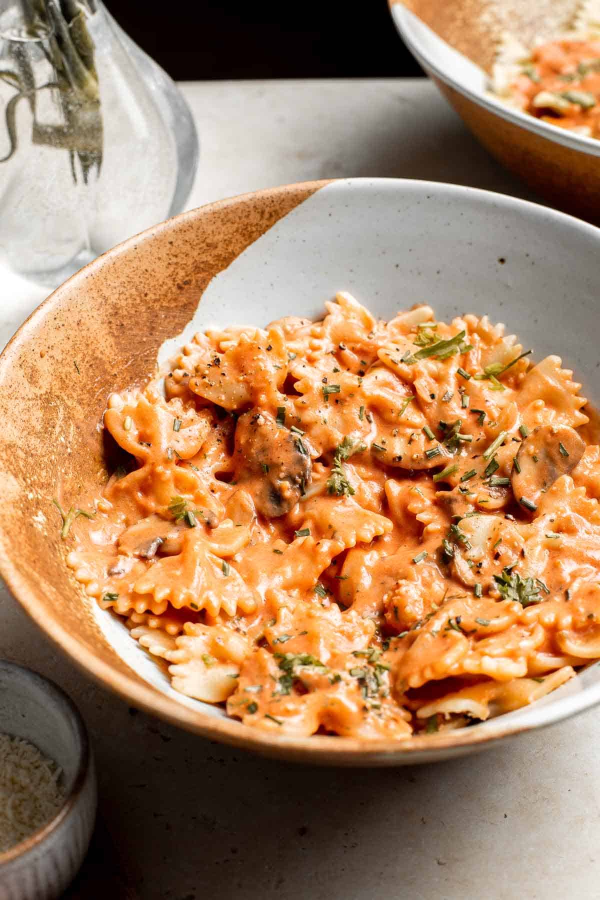 Farfalle pasta with mushroom rose sauce is creamy yet light, delicious and flavorful, and quick and easy to make in 20 minutes. Best comfort food dinner! | aheadofthyme.com