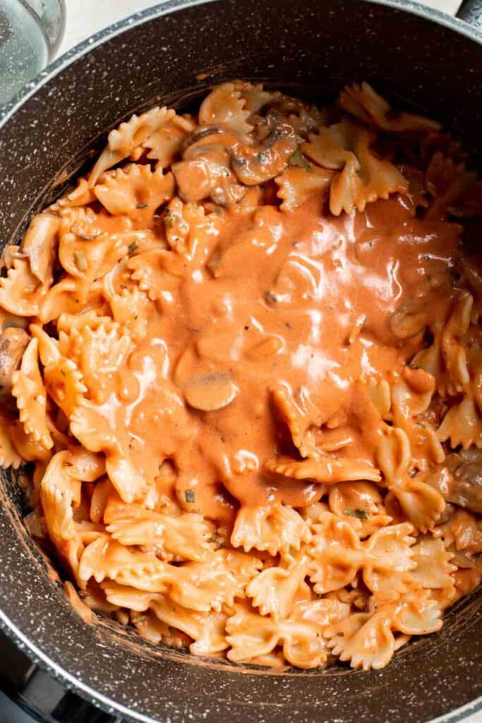 Farfalle pasta with mushroom rose sauce is creamy yet light, delicious and flavorful, and quick and easy to make in 20 minutes. Best comfort food dinner! | aheadofthyme.com