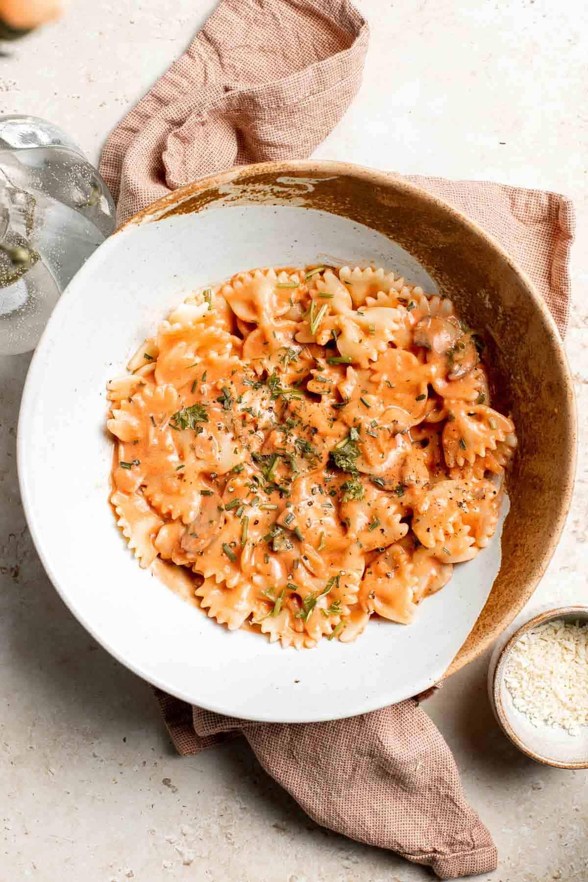 Farfalle pasta with mushroom rose sauce is creamy yet light, delicious and flavorful, and quick and easy to make in 20 minutes. Best comfort food dinner! | aheadofthyme.com