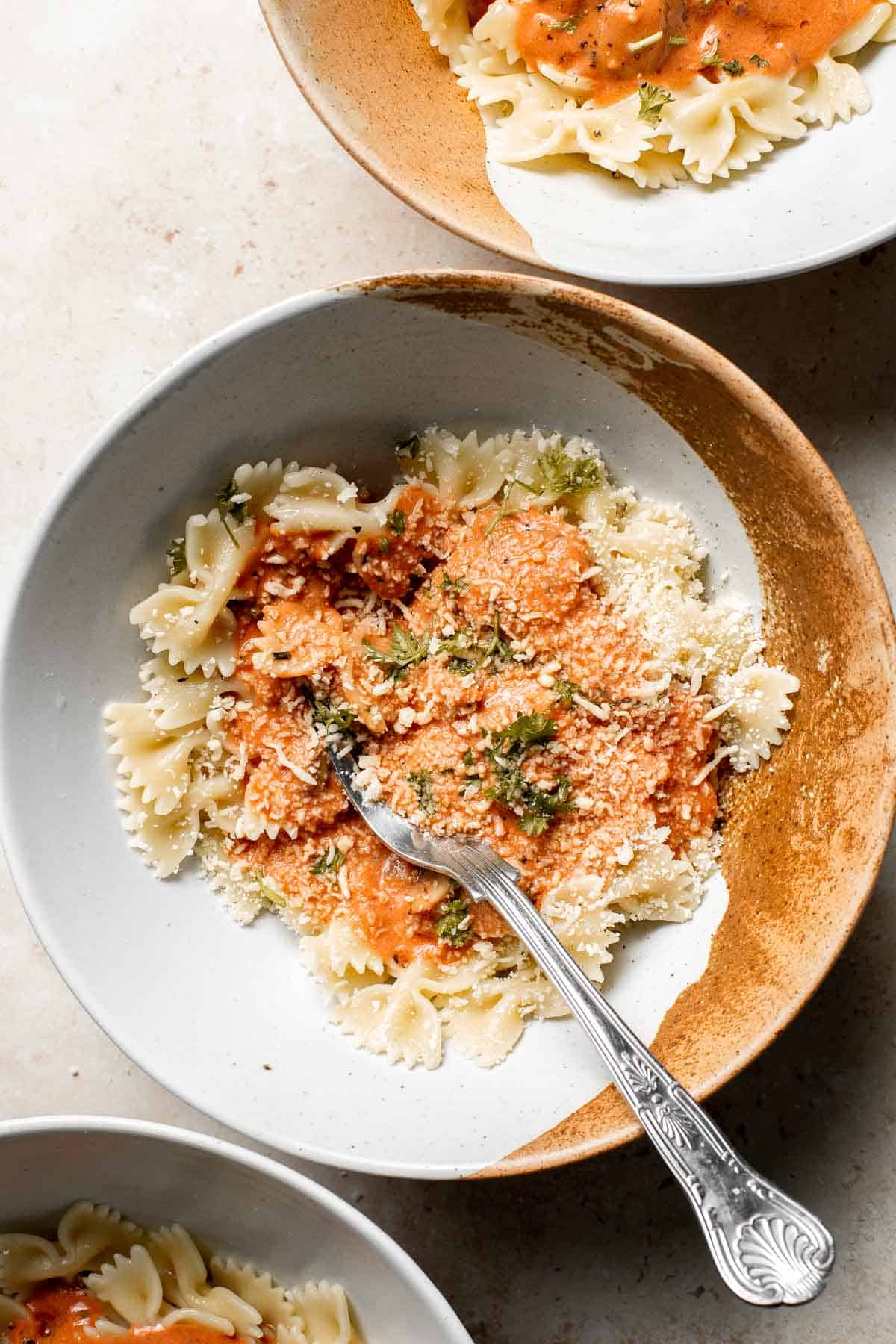 Farfalle pasta with mushroom rose sauce is creamy yet light, delicious and flavorful, and quick and easy to make in 20 minutes. Best comfort food dinner! | aheadofthyme.com