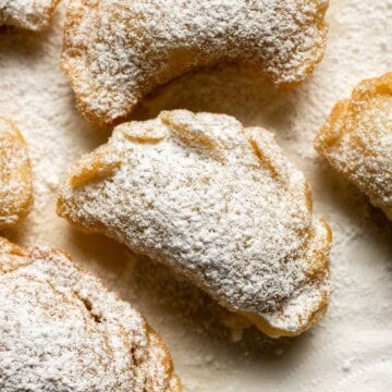Ghotab (or Qottab) are traditional Persian walnut-filled crescent pastries that are delicate and crisp outside with a spiced, nutty filling inside. | aheadofthyme.com