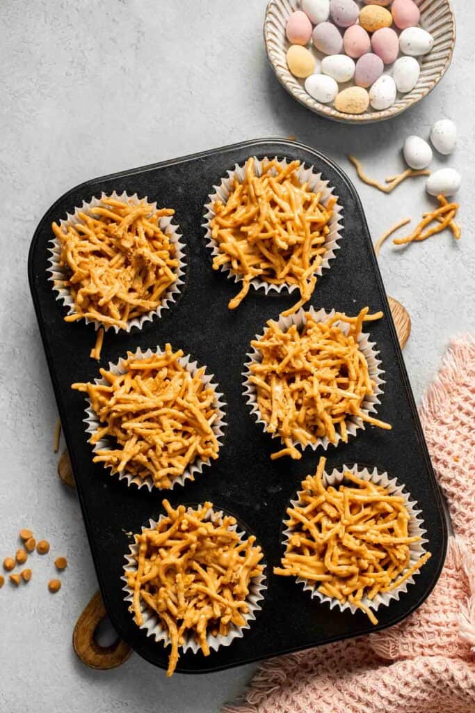 No Bake Bird's Nest Cookies are a fun and festive Easter treat made with butterscotch and peanut butter mixture and topped with chocolate mini eggs. | aheadofthyme.com