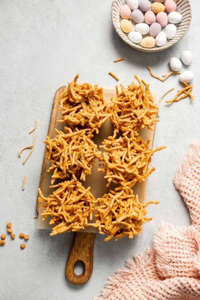 No Bake Bird's Nest Cookies are a fun and festive Easter treat made with butterscotch and peanut butter mixture and topped with chocolate mini eggs. | aheadofthyme.com
