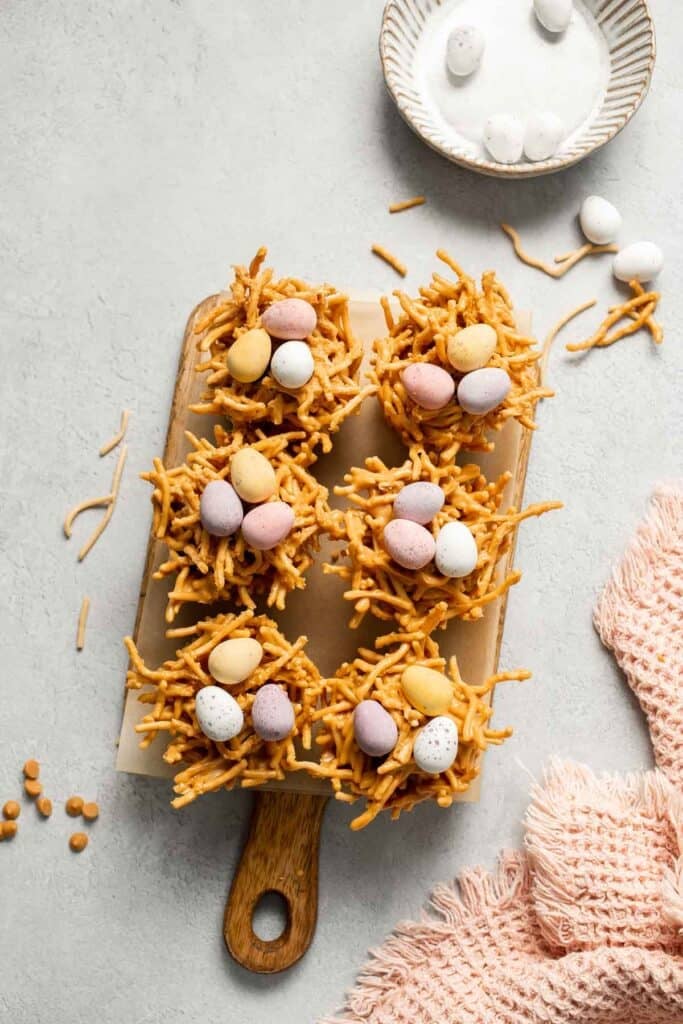 No Bake Bird's Nest Cookies are a fun and festive Easter treat made with butterscotch and peanut butter mixture and topped with chocolate mini eggs. | aheadofthyme.com