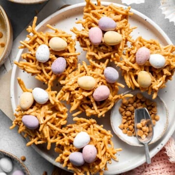 No Bake Bird's Nest Cookies are a fun and festive Easter treat made with butterscotch and peanut butter mixture and topped with chocolate mini eggs. | aheadofthyme.com