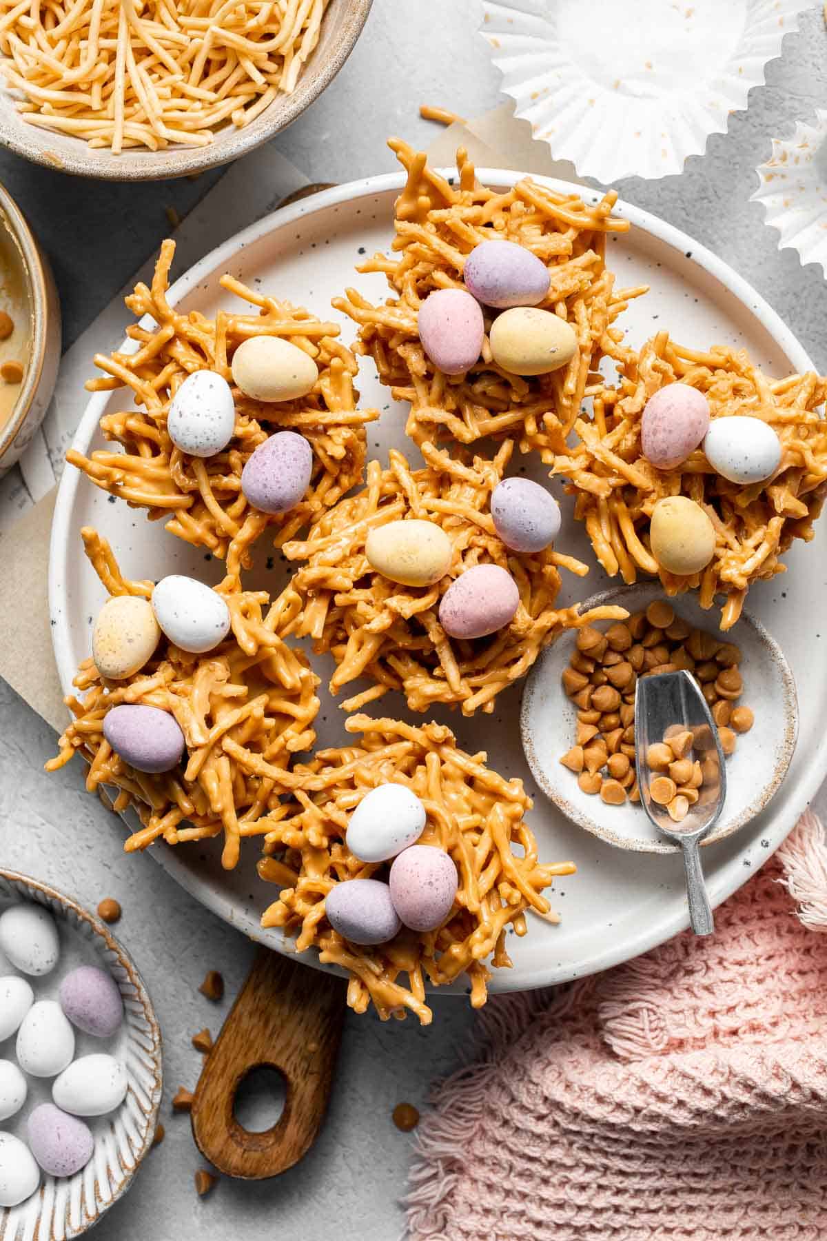 No Bake Bird's Nest Cookies are a fun and festive Easter treat made with butterscotch and peanut butter mixture and topped with chocolate mini eggs. | aheadofthyme.com
