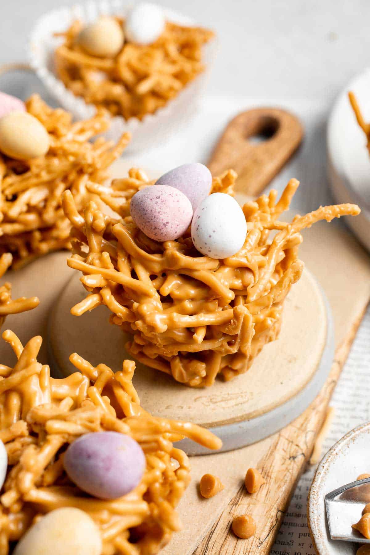 No Bake Bird's Nest Cookies are a fun and festive Easter treat made with butterscotch and peanut butter mixture and topped with chocolate mini eggs. | aheadofthyme.com