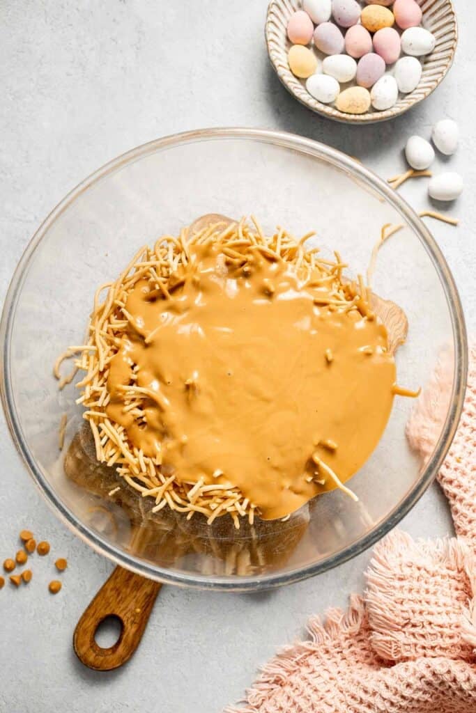 No Bake Bird's Nest Cookies are a fun and festive Easter treat made with butterscotch and peanut butter mixture and topped with chocolate mini eggs. | aheadofthyme.com