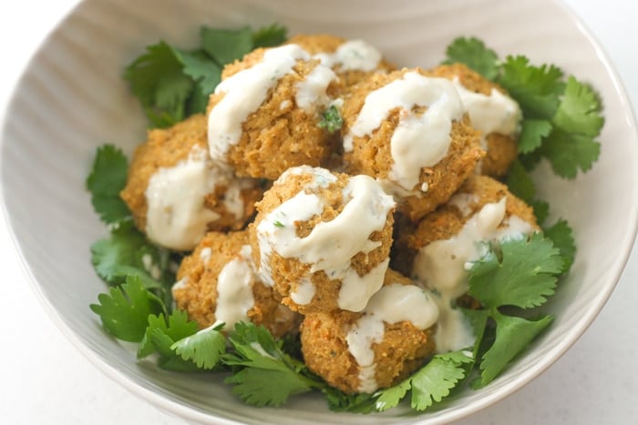 Quinoa, Cauliflower and Chickpea Vegetarian Meatballs with Tahini Sauce: Vegetarian meatballs are easy to make with a combination of quinoa, cauliflower, chickpeas and an assortment of spices and herbs, drizzled with a homemade tahini sauce | aheadofthyme.com