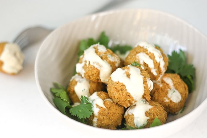 Quinoa, Cauliflower and Chickpea Vegetarian Meatballs with Tahini Sauce: Vegetarian meatballs are easy to make with a combination of quinoa, cauliflower, chickpeas and an assortment of spices and herbs, drizzled with a homemade tahini sauce | aheadofthyme.com