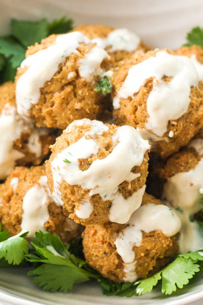 Quinoa, Cauliflower and Chickpea Vegetarian Meatballs with Tahini Sauce: Vegetarian meatballs are easy to make with a combination of quinoa, cauliflower, chickpeas and an assortment of spices and herbs, drizzled with a homemade tahini sauce | aheadofthyme.com